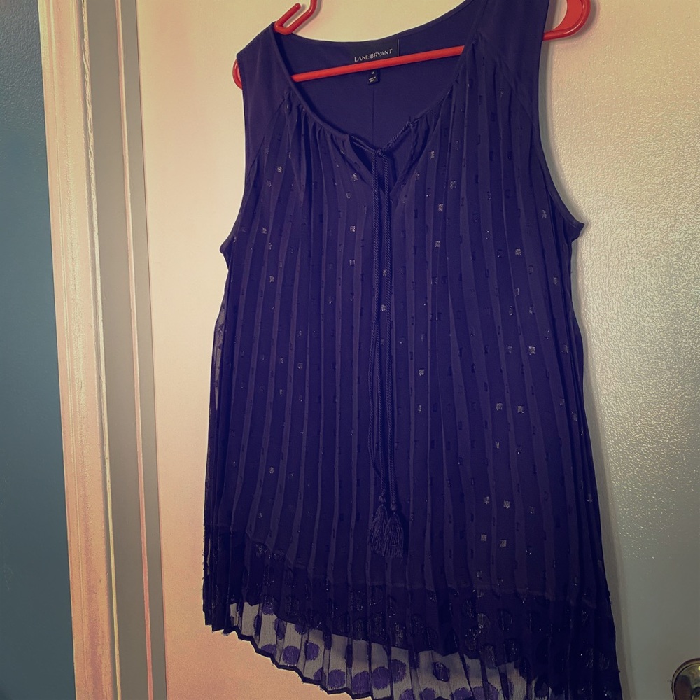 Sleeveless purple blouse .